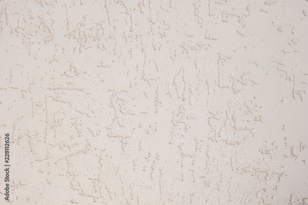 Texture of decorative plaster with a relief. White plaster. Close-up. Texture of decorative plaster with a relief. White plaster. Close-up.