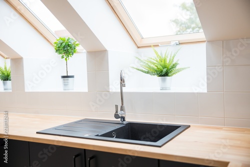 Konstfotografi Black sink in the kitchen.