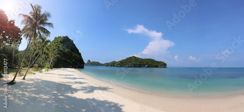 Panorama of the tropical beach with coconut shadow on the white sand