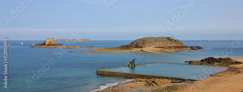 Swimming pool and small island Grand Be. Saint Malo, Brittany. Scene at the french coast. photo