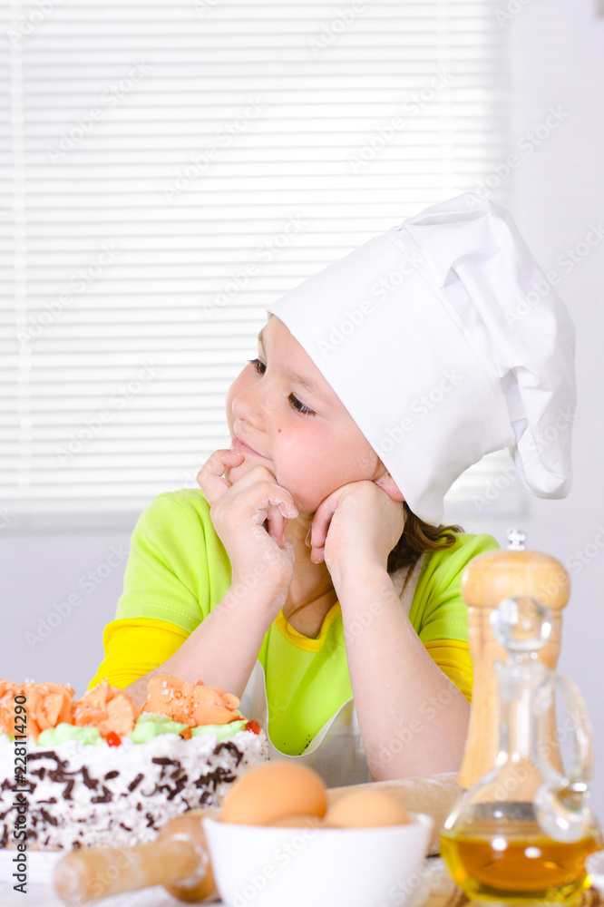 Cute girl baking cake in the kitchen Cute girl baking cake in the kitchen