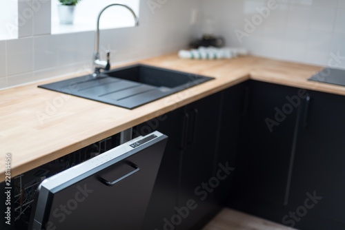 Modern open dishwasher photo