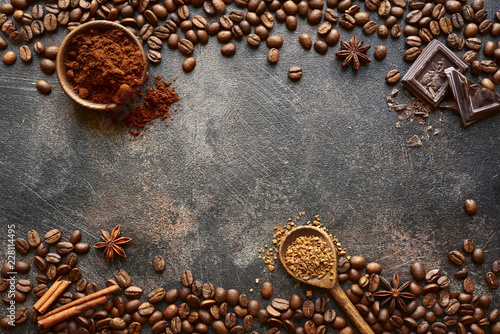 Ground coffee and coffee beans with spices .Top view with copy space.