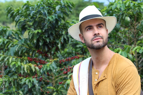 Handsome farmer in coffee plantation 