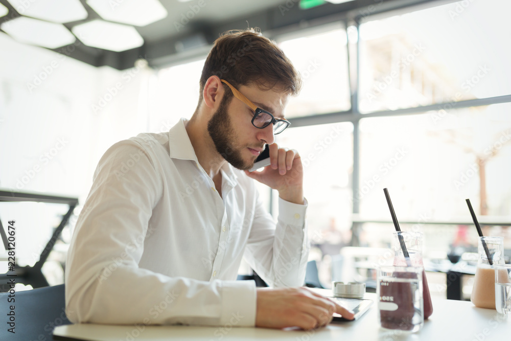 Confident busy businessman working on tablet Confident busy businessman working on tablet