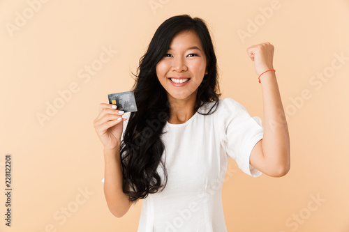 Portrait of a happy young asian woman isolated