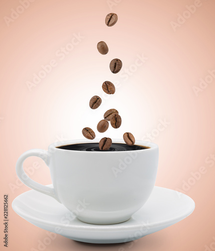 coffee beans falling into cup