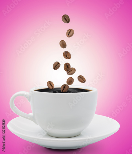 coffee beans falling into cup