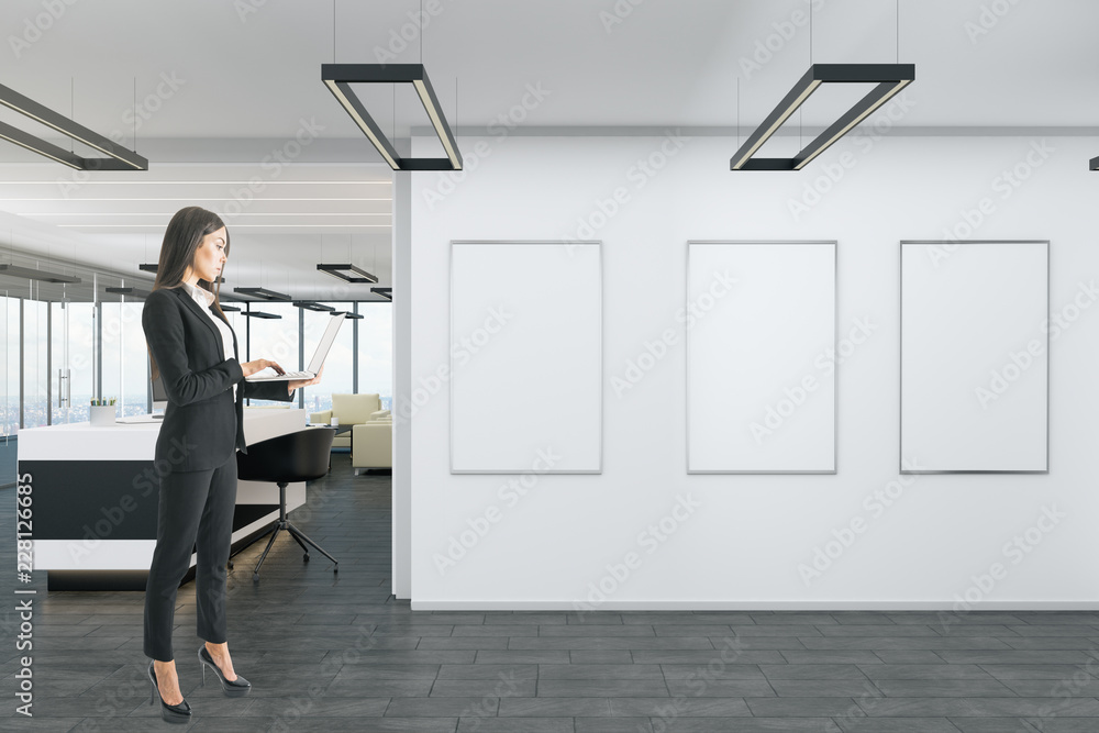 Woman in office with banner Woman in office with banner