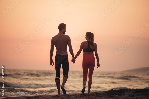 Couple Walking on Sandy Beach