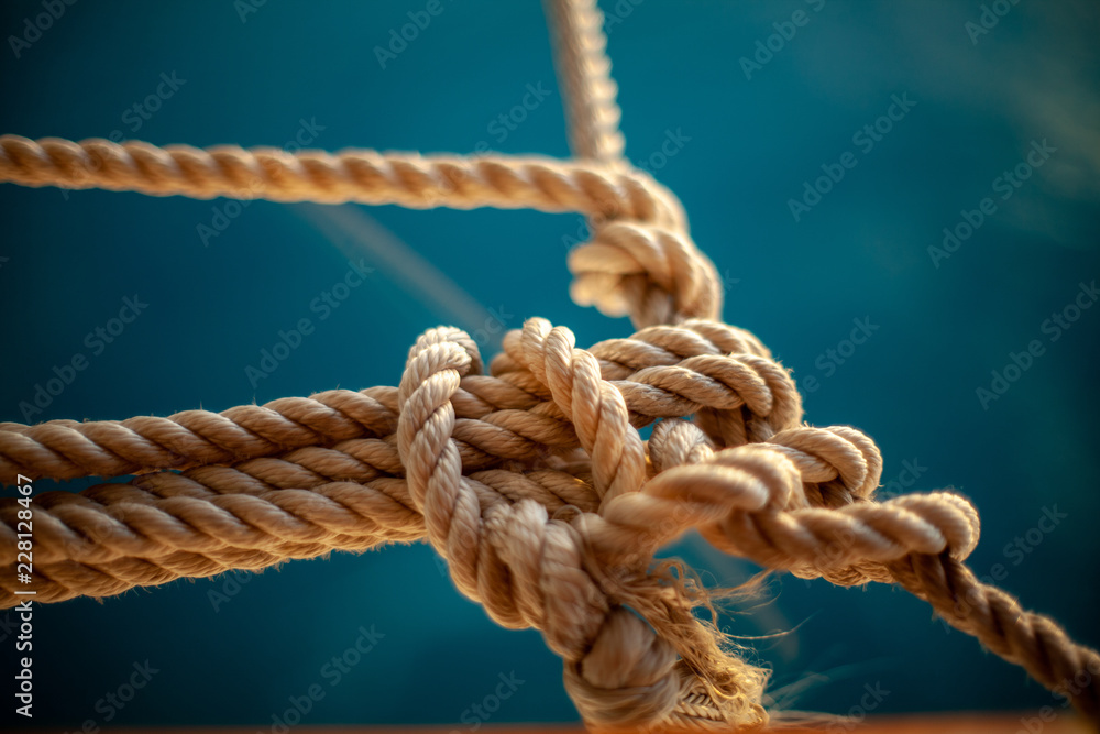 rope with knot on wooden background