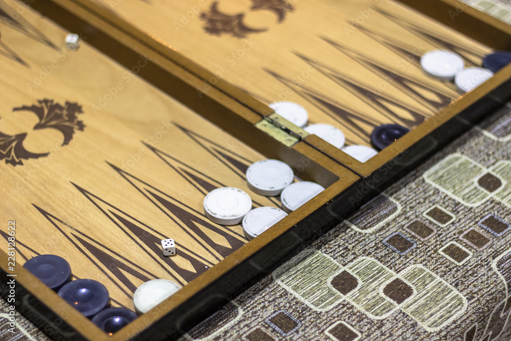 Close-up angled shoot of dice of backgammon under dim light Close-up angled shoot of dice of backgammon under dim light