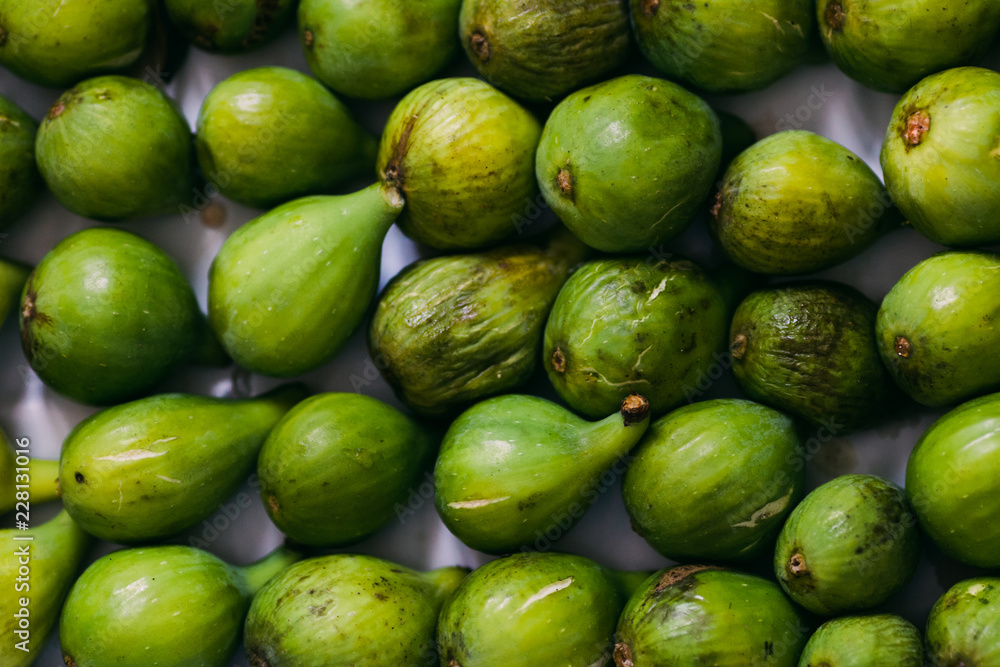 Top shot of arranged green figs Top shot of arranged green figs