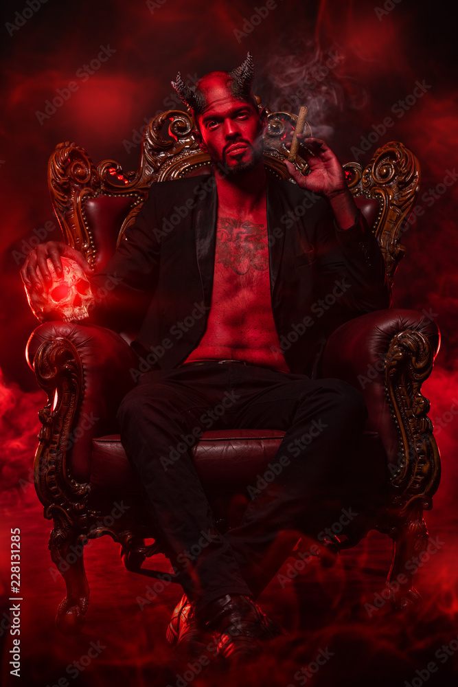 Fototapeta premium wicked man in armchair