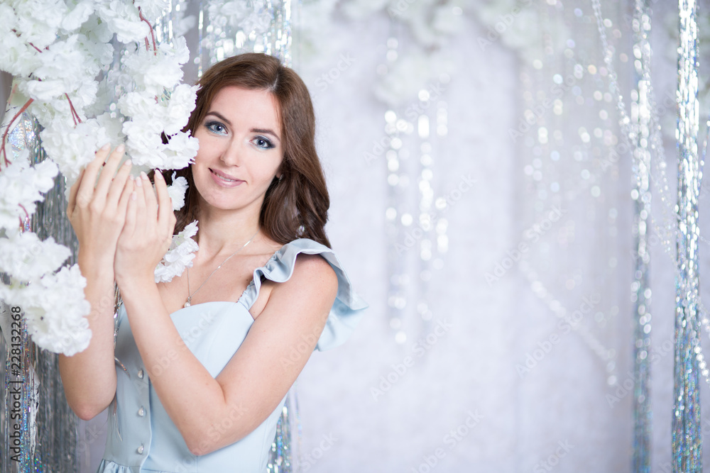 Beautiful young woman in silver studio Beautiful young woman in silver studio