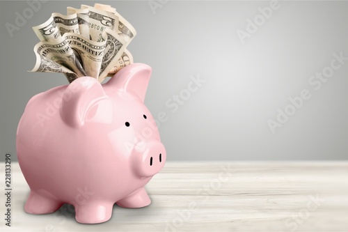 Piggy bank and  money on background