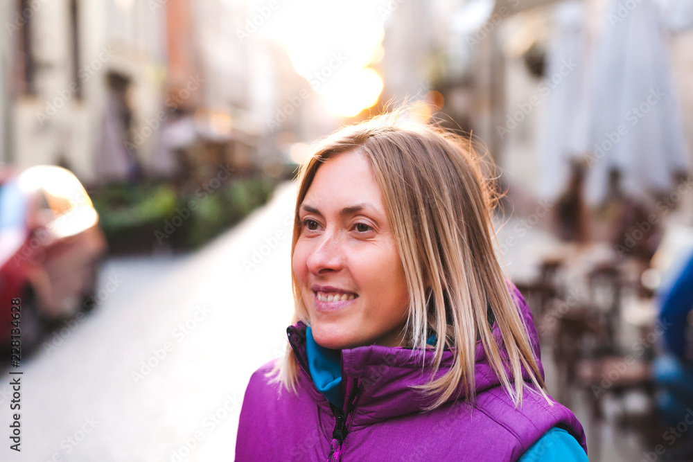 Fototapeta premium Woman on a city street.