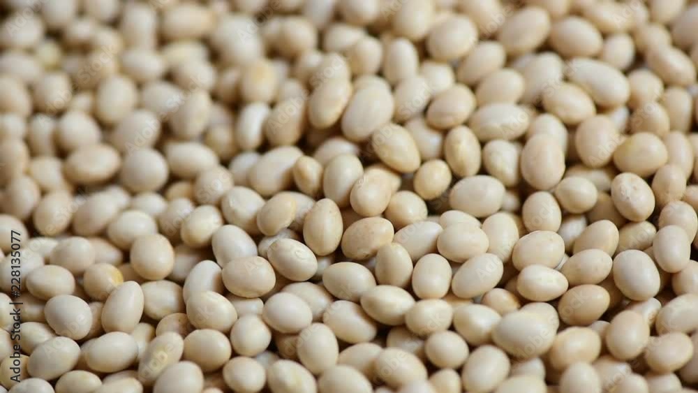 Whirling Navy beans nutrition grains rotating background. Healthy and nutrition food eaten with alcoholic drinks concept. Benefit of protein theme. HD video footage Whirling Navy beans nutrition grains rotating background. Healthy and nutrition food eaten with alcoholic drinks concept. Benefit of protein theme. HD video footage