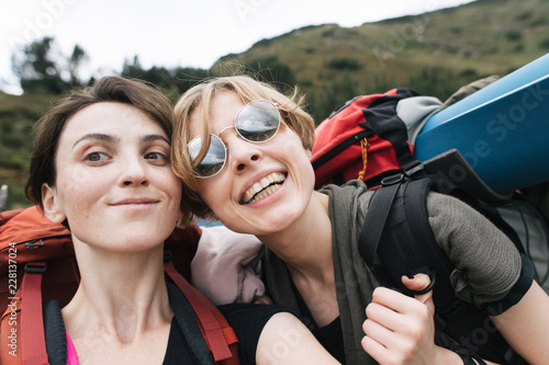 girls make a selfie in a hike in the mountains