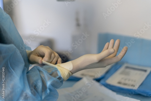 doctor putting gloves.contagious virus disease concept