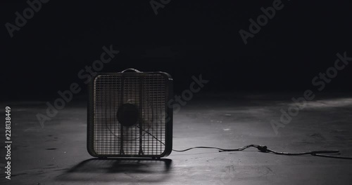 Box fan silhouette and cord in plain black studio 