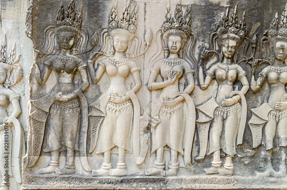Bas-relief with the devatas adorning the walls of the main complex of Angkor Wat