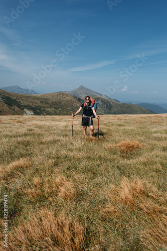 a man goes to a hike in the mountains