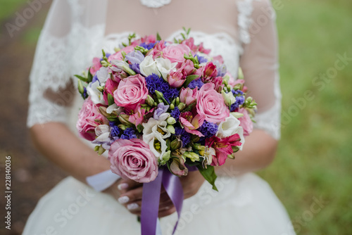 bouquet of pink roses, bride holds a bouquet, wedding walk, bride in white dress photo