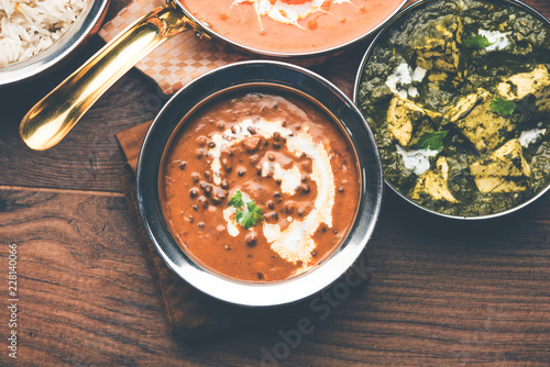 Dal makhani / makhni is a popular dish from India. Made with ingredients like whole black lentil, butter and cream. Served with Naan/roti and rice photo