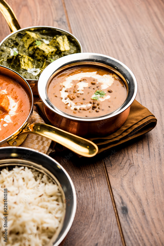 Indian Lunch / Dinner main course food in group includes Paneer Butter Masala, Dal Makhani, Palak Paneer, Roti, Rice etc, Selective focus Indian Lunch / Dinner main course food in group includes Paneer Butter Masala, Dal Makhani, Palak Paneer, Roti, Rice etc, Selective focus