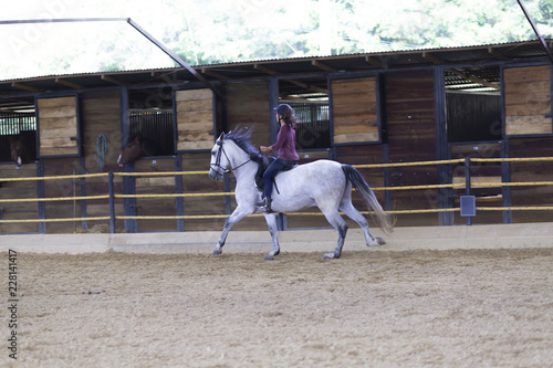 Beautiful Teenager Riding a Horse