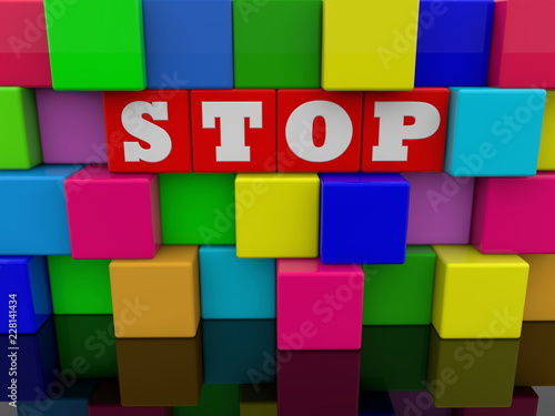 Stop concept on abstract wall of colorful toy cubes
