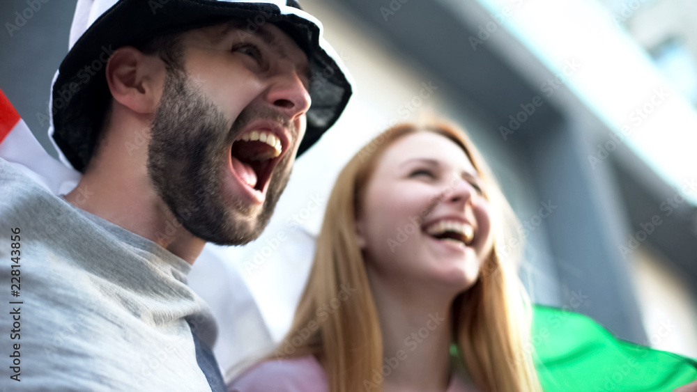 Football supporters chanting, rejoicing victory of national team, championship Football supporters chanting, rejoicing victory of national team, championship