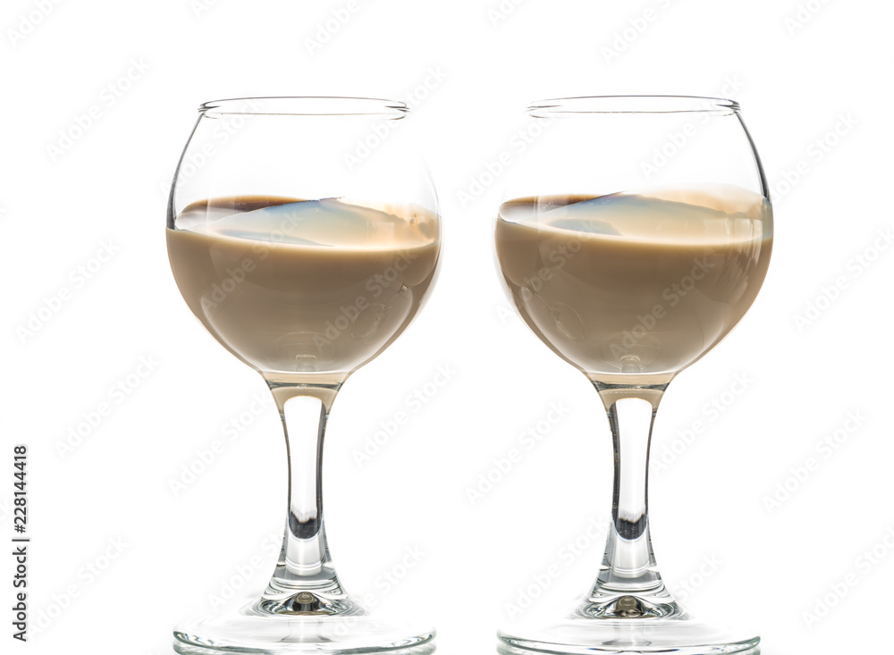 Pour chocolate thick liquor in two round glasses Pour chocolate thick liquor in two round glasses