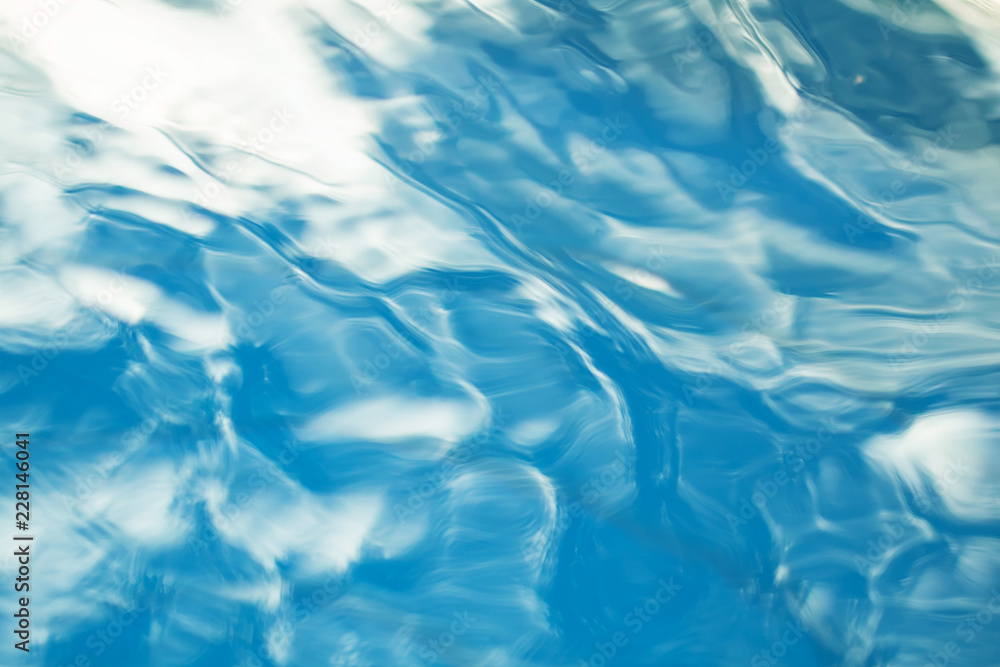 The smooth natural blue water background with bokeh abstract on the sea or ocean,vintage and soft colored blur. The smooth natural blue water background with bokeh abstract on the sea or ocean,vintage and soft colored blur.