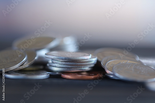 Rows of coins of Clock,cash,money, dollar on the table,finance and business concept,Tex time soft focus and blurred style,dark tone.