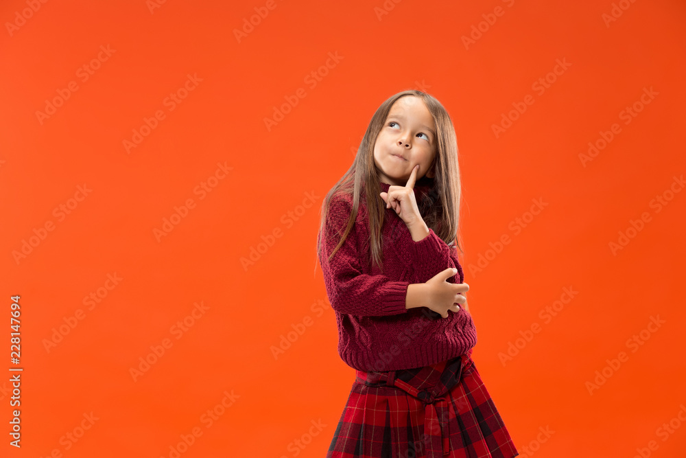 Fototapeta premium Remember all. Let me think. Doubt concept. Doubtful, thoughtful teen girl remembering something. Young emotional child. Human emotions, facial expression concept. Studio
