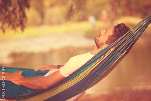 man resting on hammock