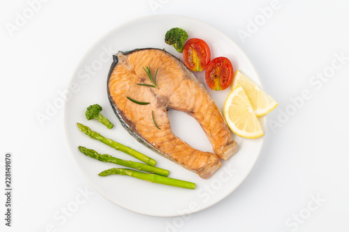 Salmon Grilled on a white plate isolated on white background.