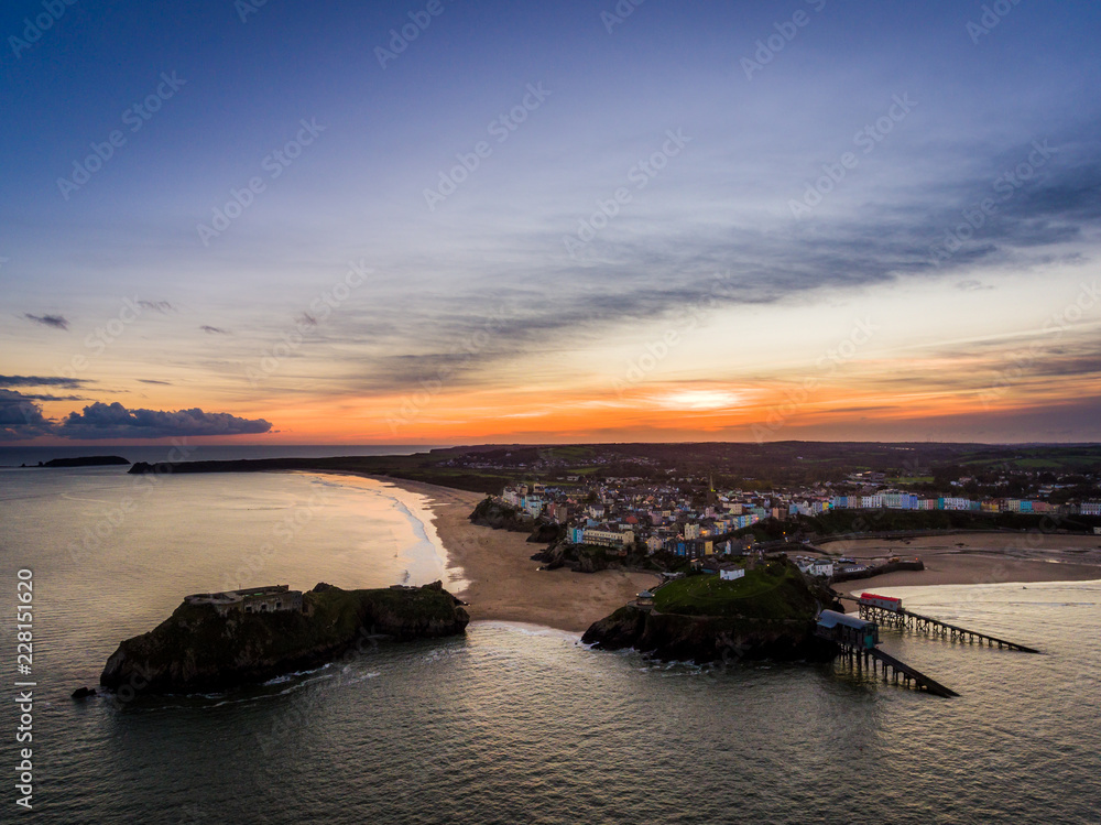 Aerial view of Tenby Beach and harbour at sunset, Pembrokeshire, Wales, UK
