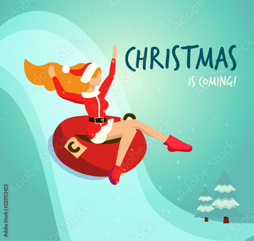 Flat illustration in vector slender girl in traditional costume of Santa Claus drives down from a snowy mountain in red tubing. Handwritten christmas is coming Greeting card. Long red hair fluttering