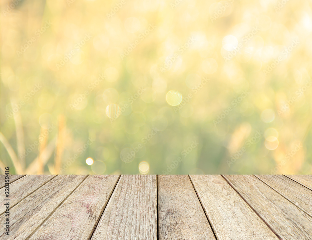 yellow gold bokeh and wood floor yellow gold bokeh and wood floor