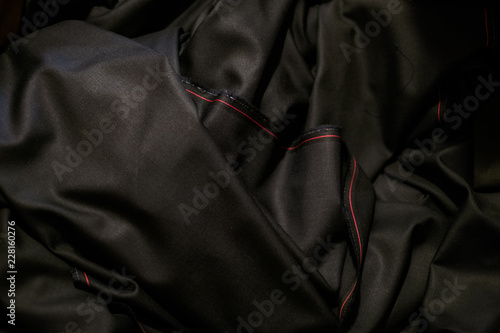 black cloth with a red stripe