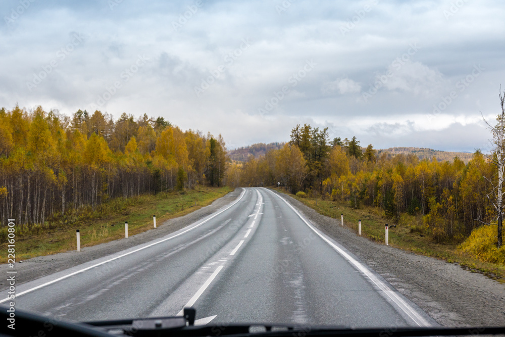 autumn view of the highway from the cab