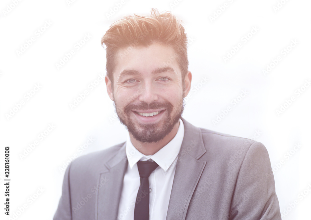 Portrait of a young businessman at the railing in the office Portrait of a young businessman at the railing in the office
