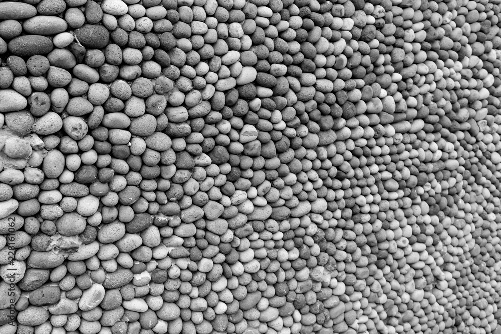 Background texture, wall consisting of small river stones Background texture, wall consisting of small river stones