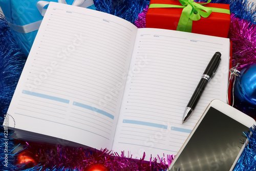 Fotografie notebook to record affairs for christmas and new year, gifts, decorations