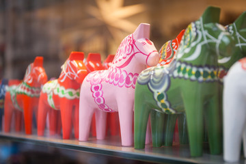 Dala on sales in a tourist shop in Stockholm, Sweeden. Dala is a traditional carved and painted wooden horse statuette symbol of Sweden.