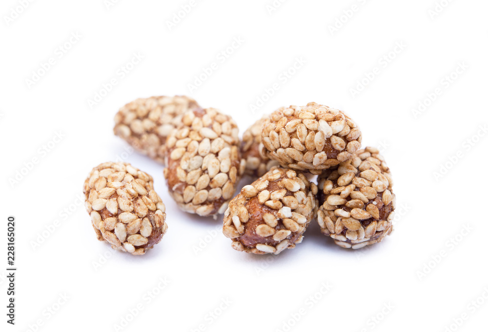 Coated peanuts with sesame isolated on white background Coated peanuts with sesame isolated on white background