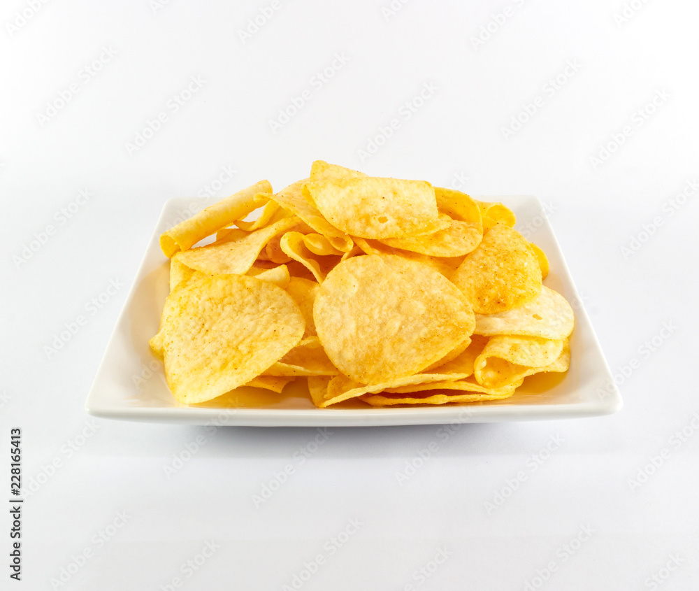 Potato chips on white dish and white background Potato chips on white dish and white background